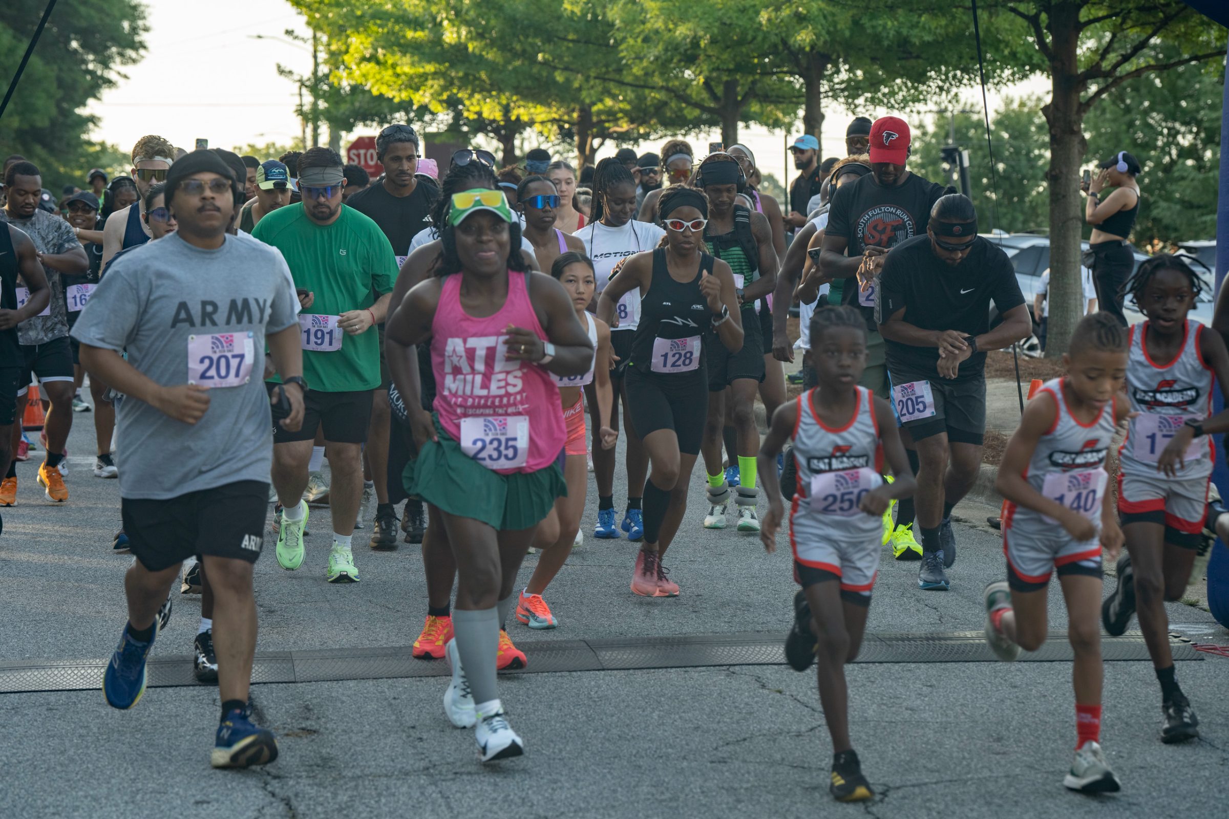 Runners taking off from the start line of The Tech Race